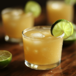 A refreshing Brazilian Mounjaro drink with apple cider vinegar, served in a glass with ice and garnished with a lime slice.